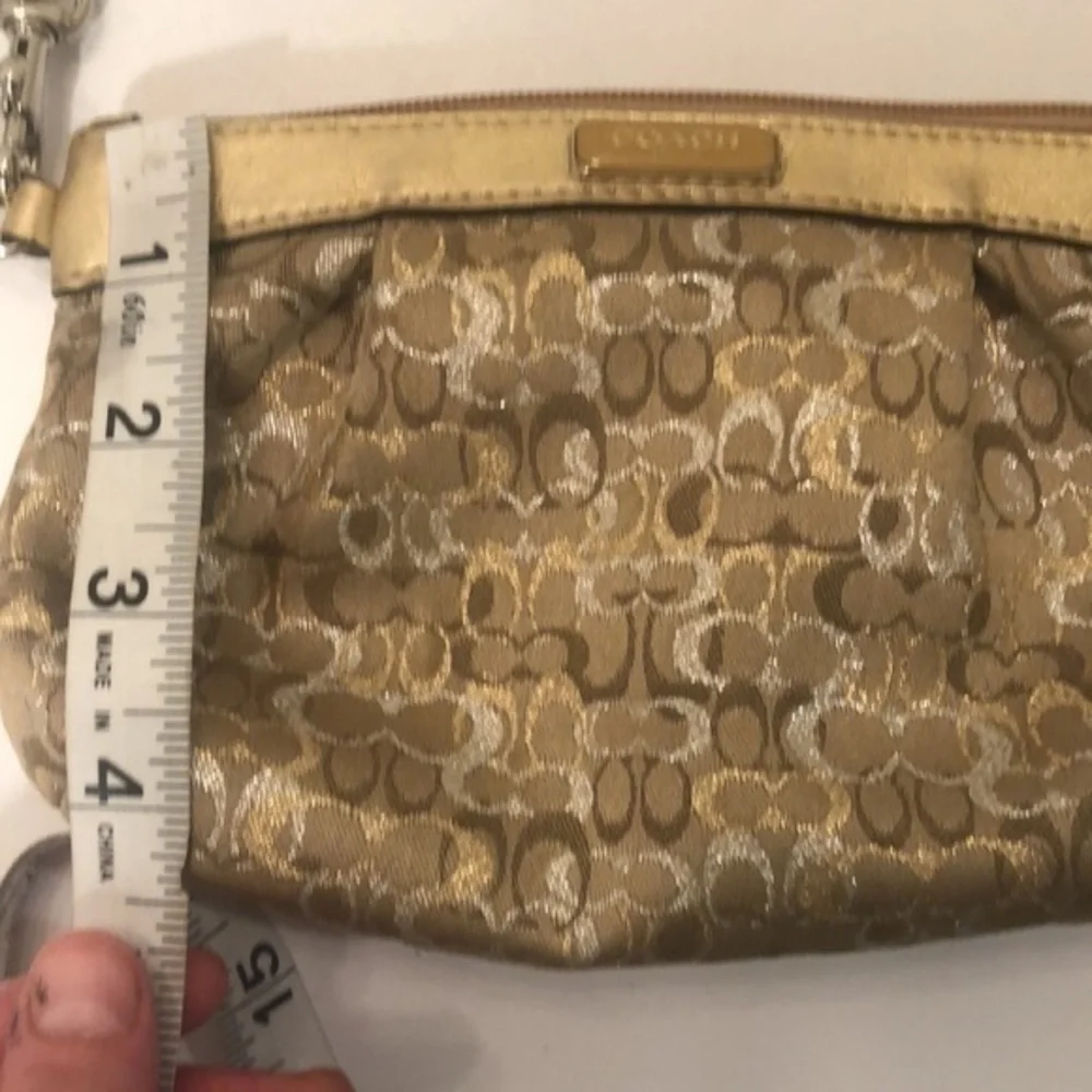 Coach gold optic wristlet